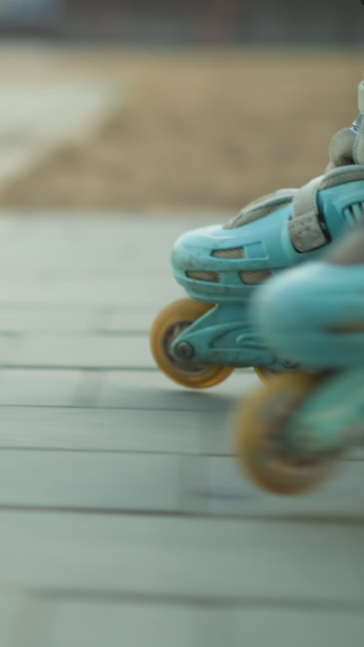 A close-up shot capturing a rollerblade in motion as it glides across a paved path in a park. The focus is on the rollerblade's wheels and the smooth movement over the pavement