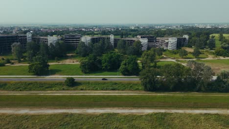 aerial view of unfinished hospital in blato zagreb surrounded by fields and roads