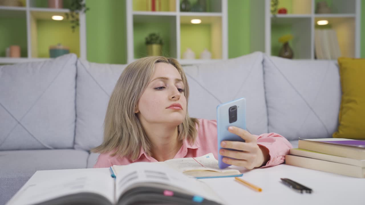 Bored young girl. He's using the phone.
