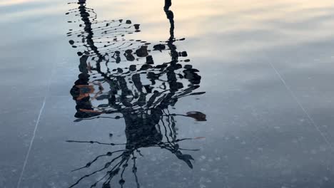 water wave move the image of a structure made by creative architecture design of contemporary modern art and the sky mirror on water in the city landscape from close up shot