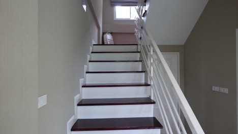 white and burgundy wooden stairscase