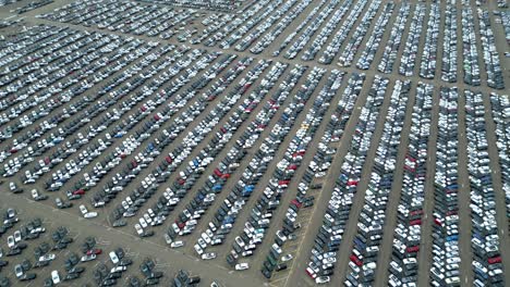 many cars on a parking lot from above, filmed with a drone in 4k