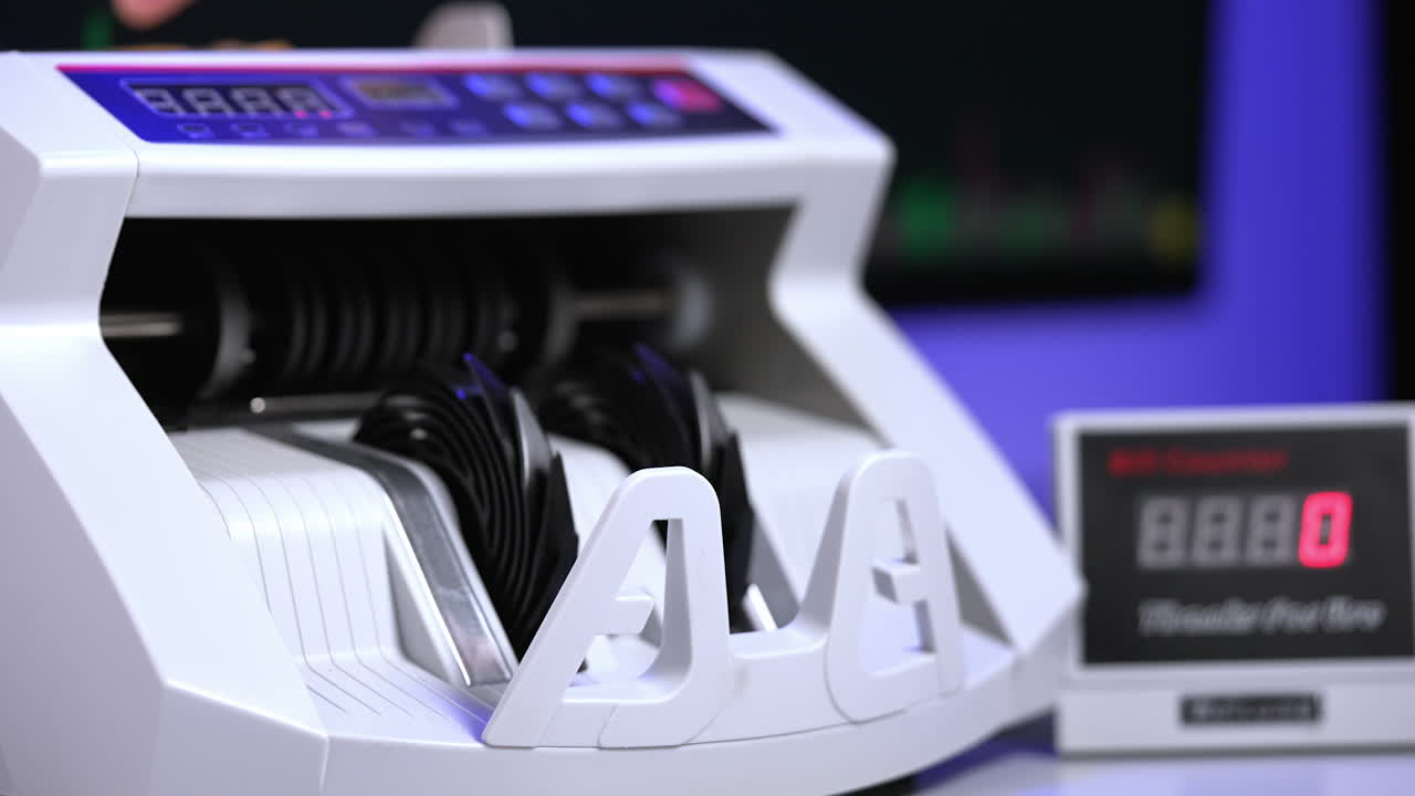 Currency counting for banking economics. Cash counting machine for banking system.