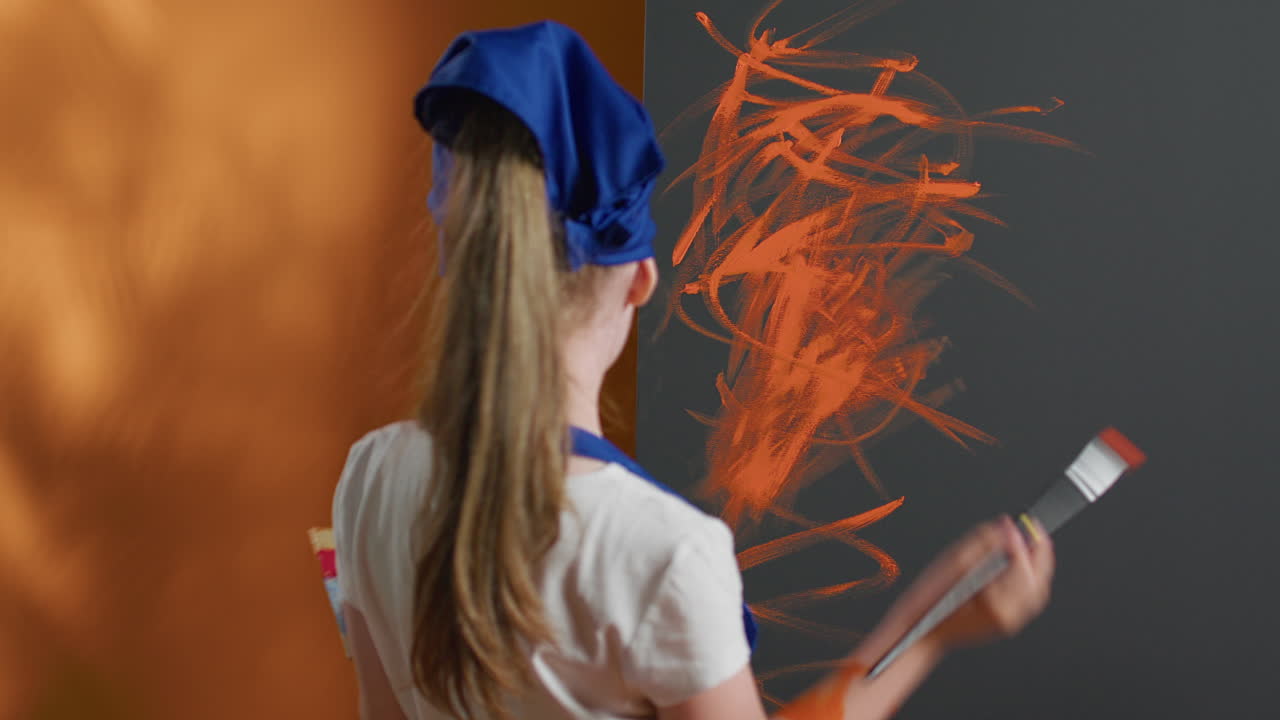 A child painting a wall