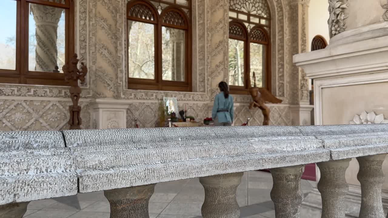 Tehran city attraction in Ferdows Garden palace Traditional old mansion architecture Stone railing and column scenic view of People walking outdoor urban park summer travel landmark Middle East Saudi