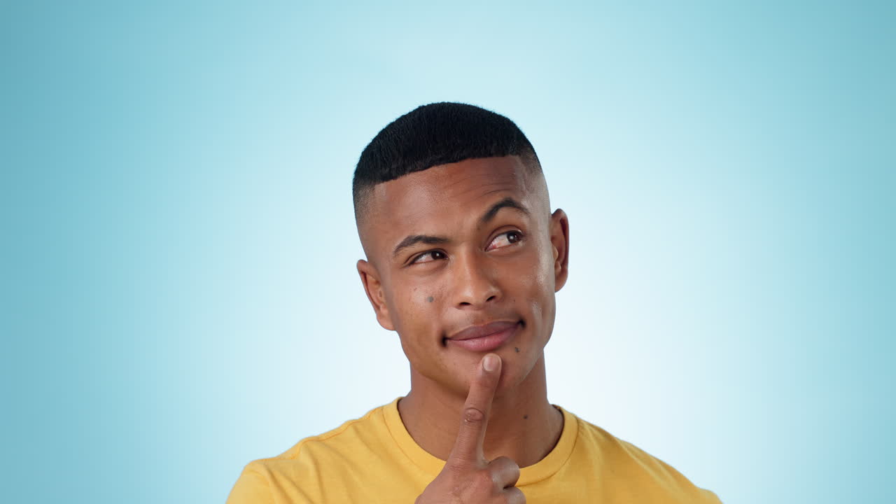 Curious, thinking and young man in a studio