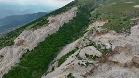 mountainside eroded by excavation and large quarry