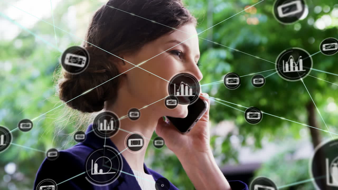 Animation of icons connecting with lines over young caucasian businesswoman talking on phone