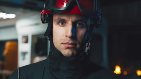close-up portrait of a male firefighter in uniform and helmet