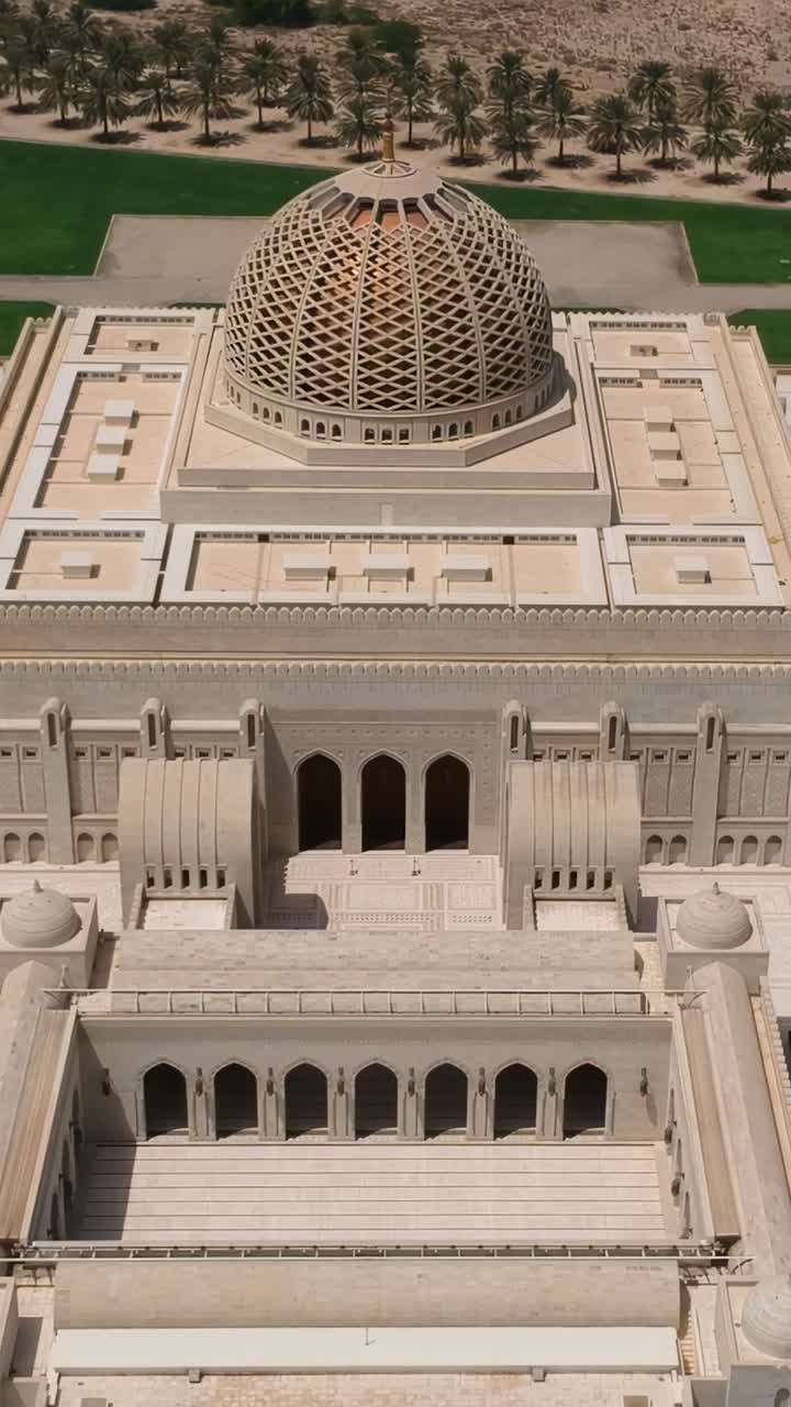 Vertical aerial of the Sultan Qaboos Grand Mosque with minaret and dome ...