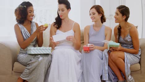 bridesmaids and bride looking at gifts 4k 4k