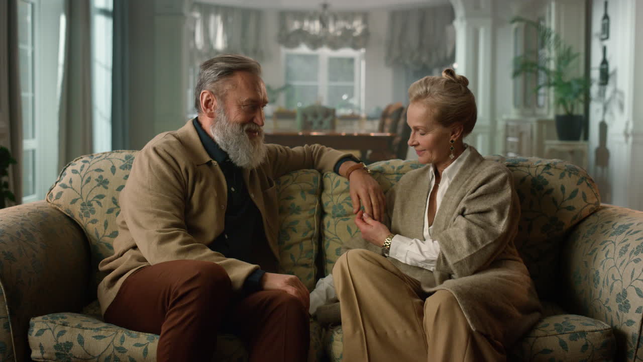 Happy old couple spending time together at home