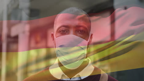 Animación-De-Ondear-La-Bandera-De-Alemania-Sobre-El-Retrato-De-Un-Hombre-Afroamericano-Con-Mascarilla-En-La-Calle