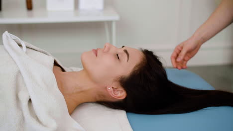 woman receiving a head massage