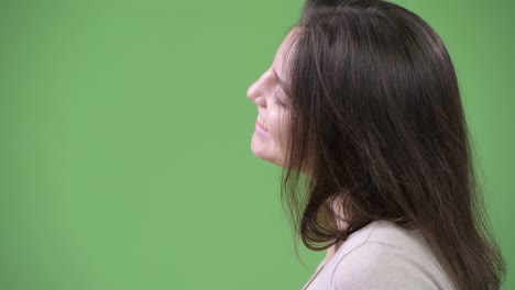 profile view of young happy beautiful woman relaxing with eyes closed