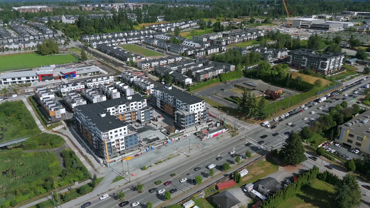 Traffic Along The Townhomes In Langley Township, BC, Canada. - aerial shot