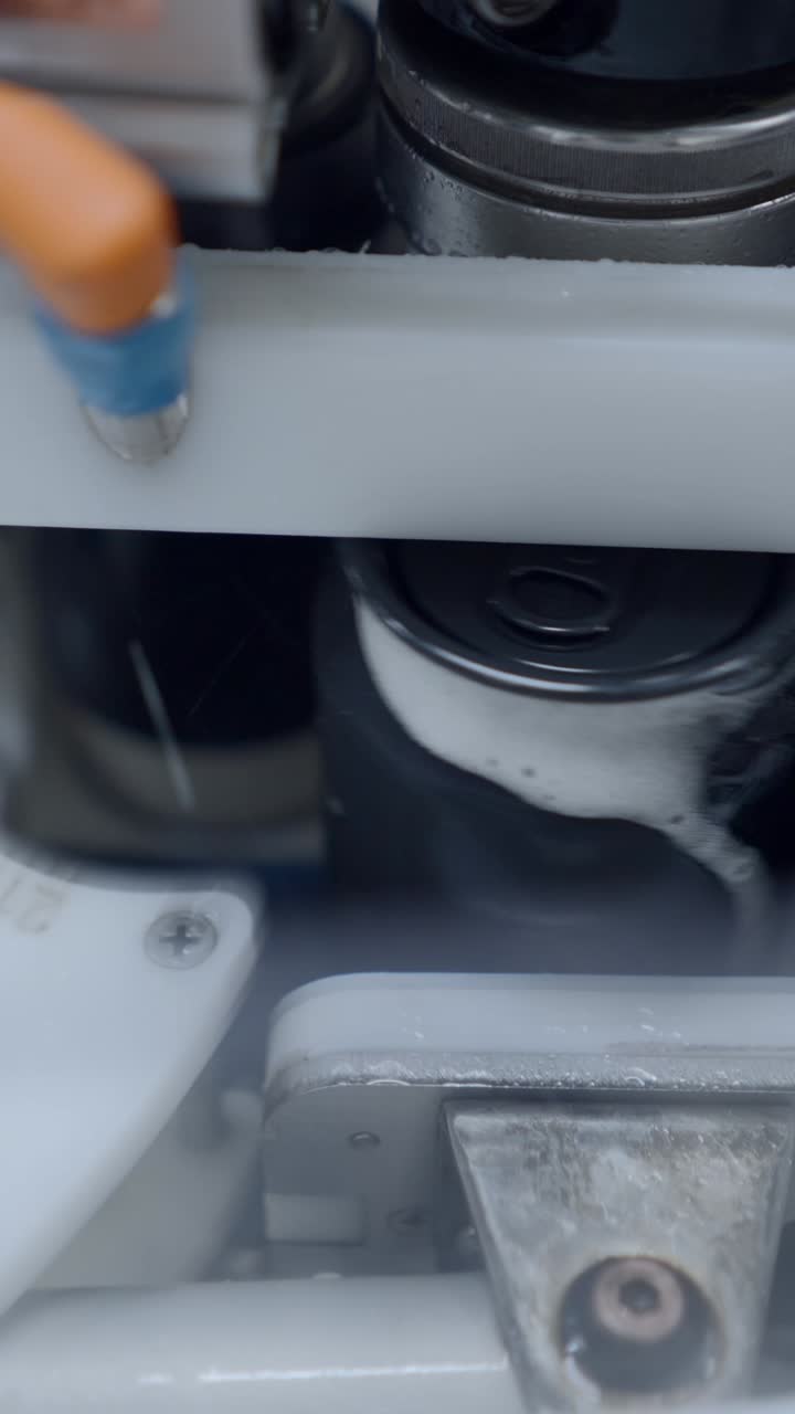 Close-up of Cans Being Filled on an Automated Production Line