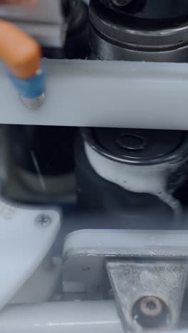 close-up of cans being filled on an automated production line