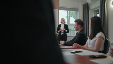 head of departments of major company are applauding female financial analyst in conference