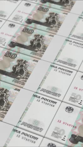 vertical video of 50 russian ruble banknotes printing by a money press