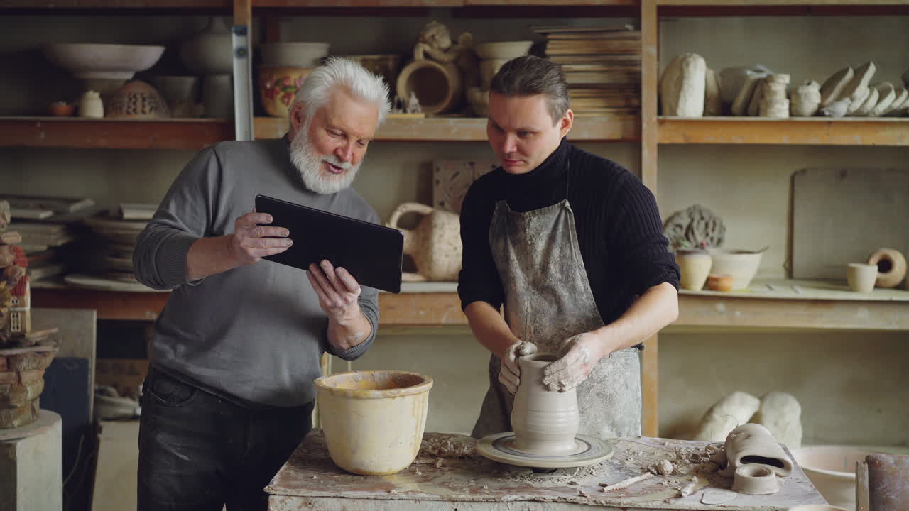 Pottery Workshop: Senior Instructor Guiding a Student