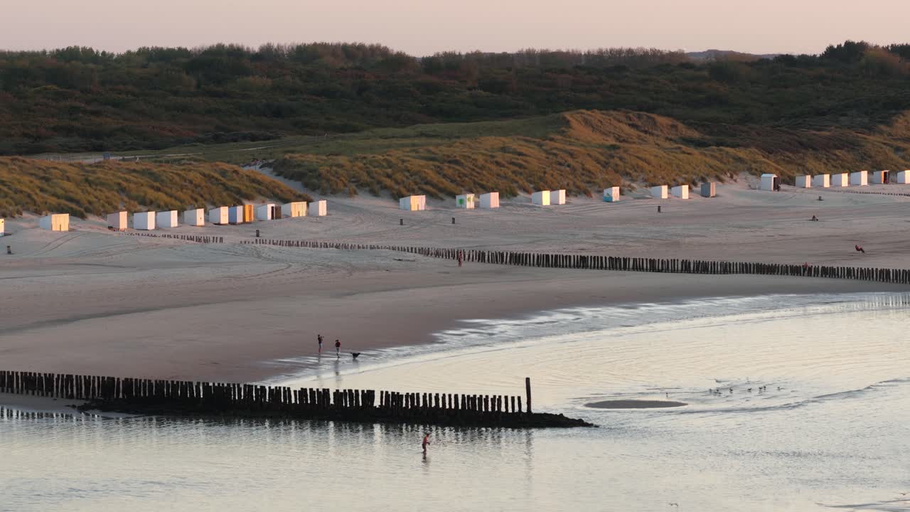 Breakwaters at Zeeland beach, The Netherlands, sunset golden hour, romantic beach, aerial views