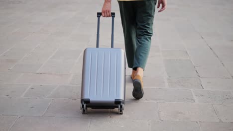 man pulling a suitcase