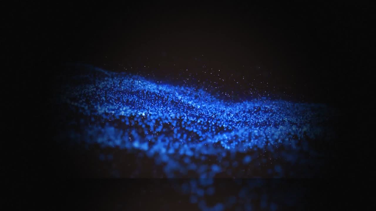 Animation of blue wave of spots on black background