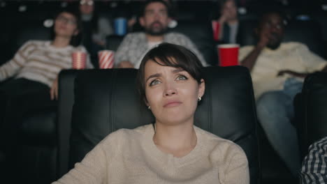 woman crying in movie theater