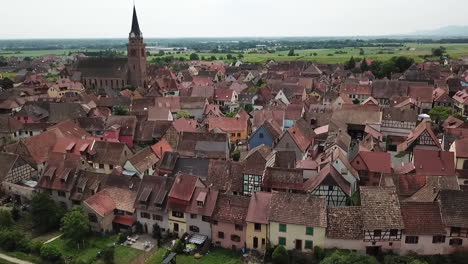 a panning forward drone shot of the fortified village of bergheim, haut-rhin