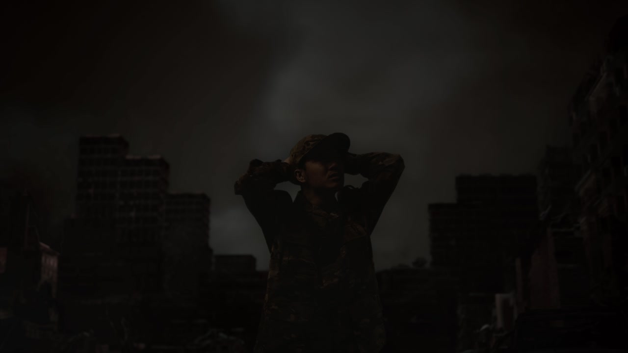 전쟁 후 폐허가 된 도시 한가운데에 서서 주위를 둘러보는 머리 뒤에 손을 고 있는 아시아 남성 군인