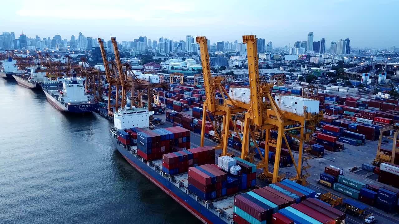 4K video : aerial view of working crane loading bridge in shipyard