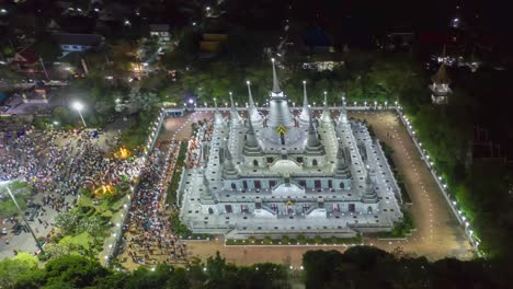 aerial time-lapse view over big pagoda in asokaram temple in samutprakarn near bangkok thailand during asalha puja(asanha bucha)buddhist festival which typically takes place in july, on the full moon.