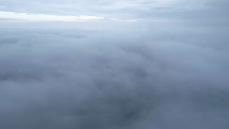 Ruins-on-mountain-peak-above-clouds-on-foggy-day