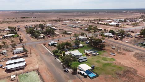 aerial view of a very small country town with tennis courts, swimming pool in the australian outback