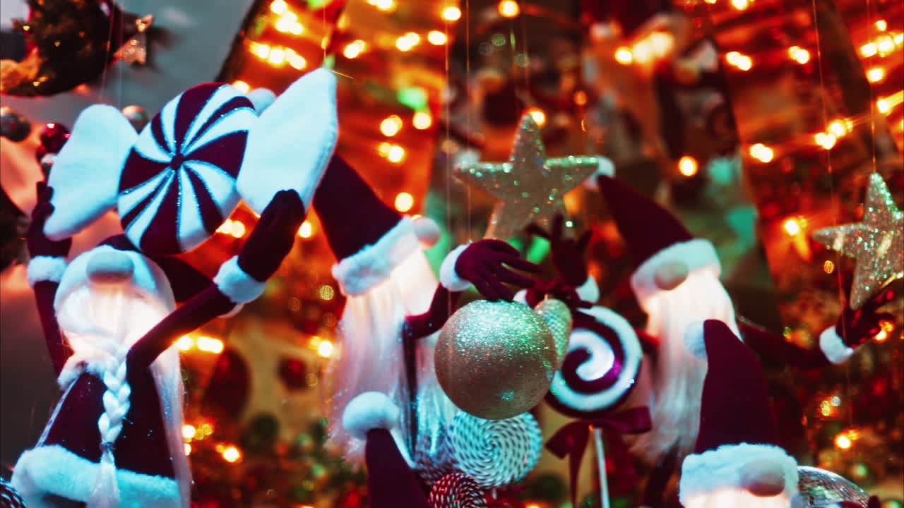 Multiple Santa Claus Christmas decorations moving in bubbles in the courtyard of the Monte Carlo Casino