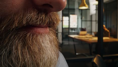 close-up of a man talking on a smartphone