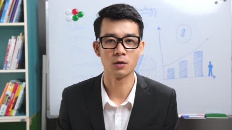 asian businessman making conference video call
