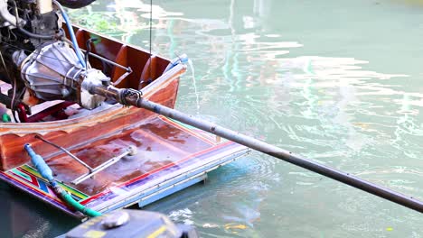 engine propels boat through bangkok's floating market