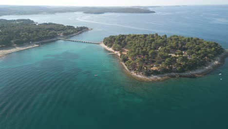 Naturist-Park-Koversada-Vrsar-aerial-view-of-famous-travel-destination,-drone-reveals-wilderness-island-with-unpolluted-nature