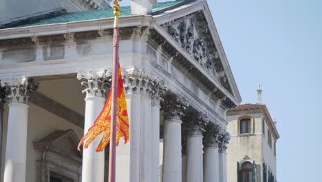 Venice-flag-fluttering-with-a-sunny-day,-Venice,-Italy