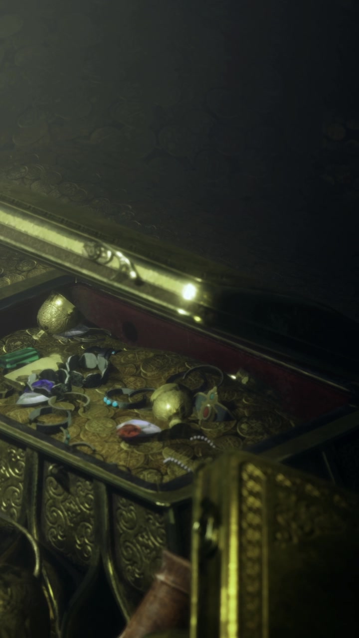 Coffre au trésor rempli d'objets et d'or dans un environnement sombre