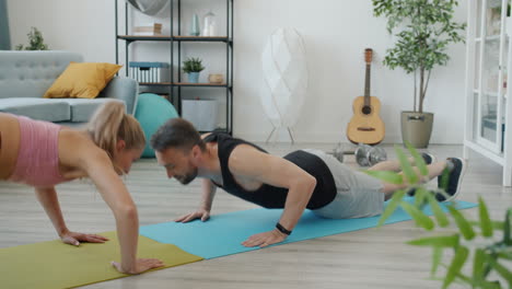 couple doing planks at home