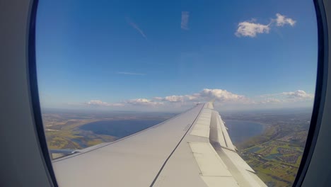 a view from a airplane window landing in orlando florida from the sky