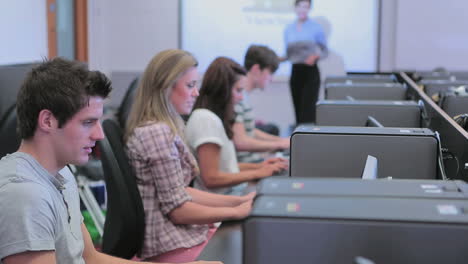 teacher standing at the computer room