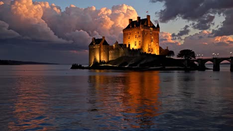 illuminated island castle at sunset