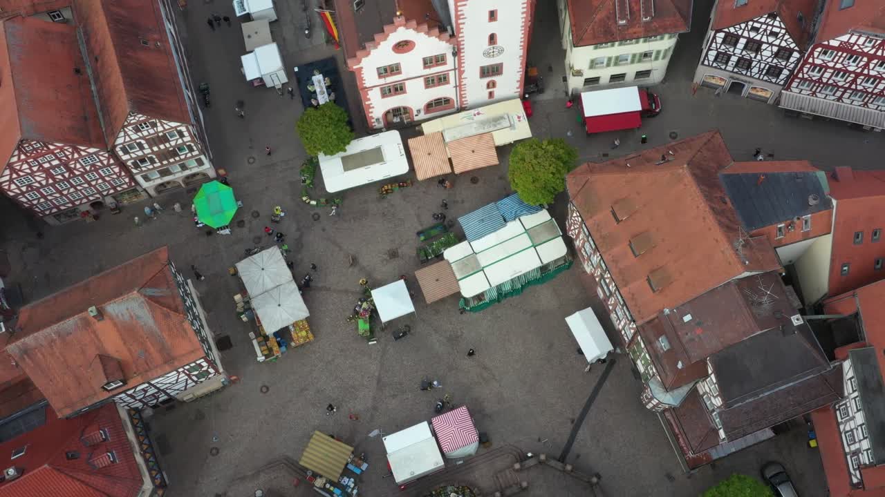 Aerial overhead shot of a sunday market on a european town square