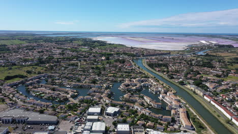 Beautiful-residential-marina-in-Aigues-Mortes-along-a-canal-with-pink-salt-lakes