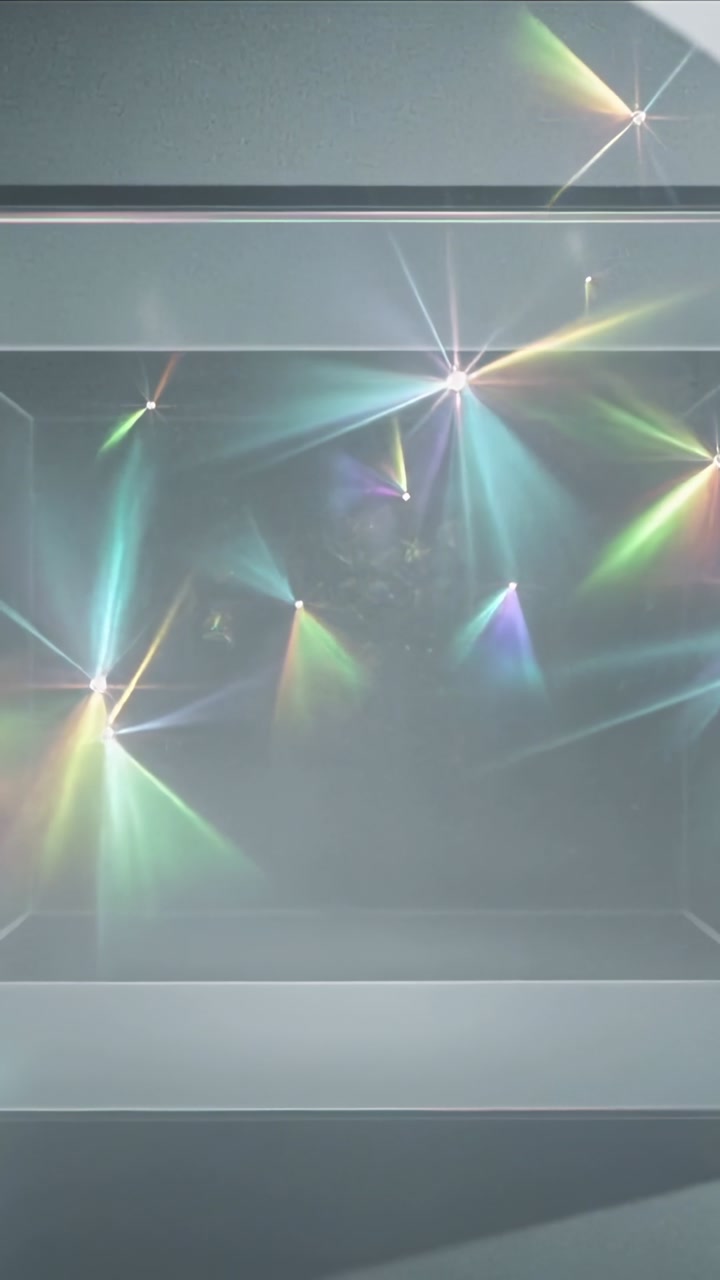 Vertical video: Prism flares shifting across glass panel, trim, band moving from off-frame light