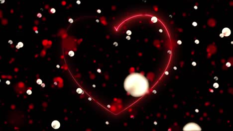 animación de corazón rojo y manchas brillantes en fondo negro